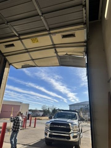 Impact-damaged commercial sectional door