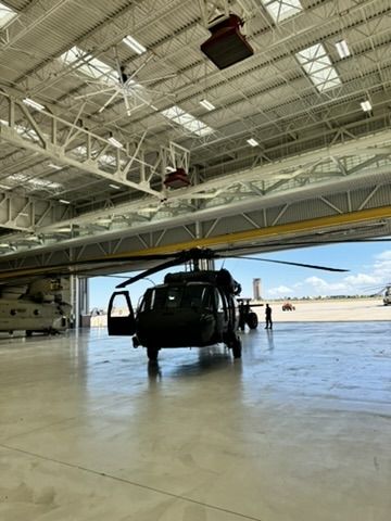 Aircraft hangar with large hangar doors open